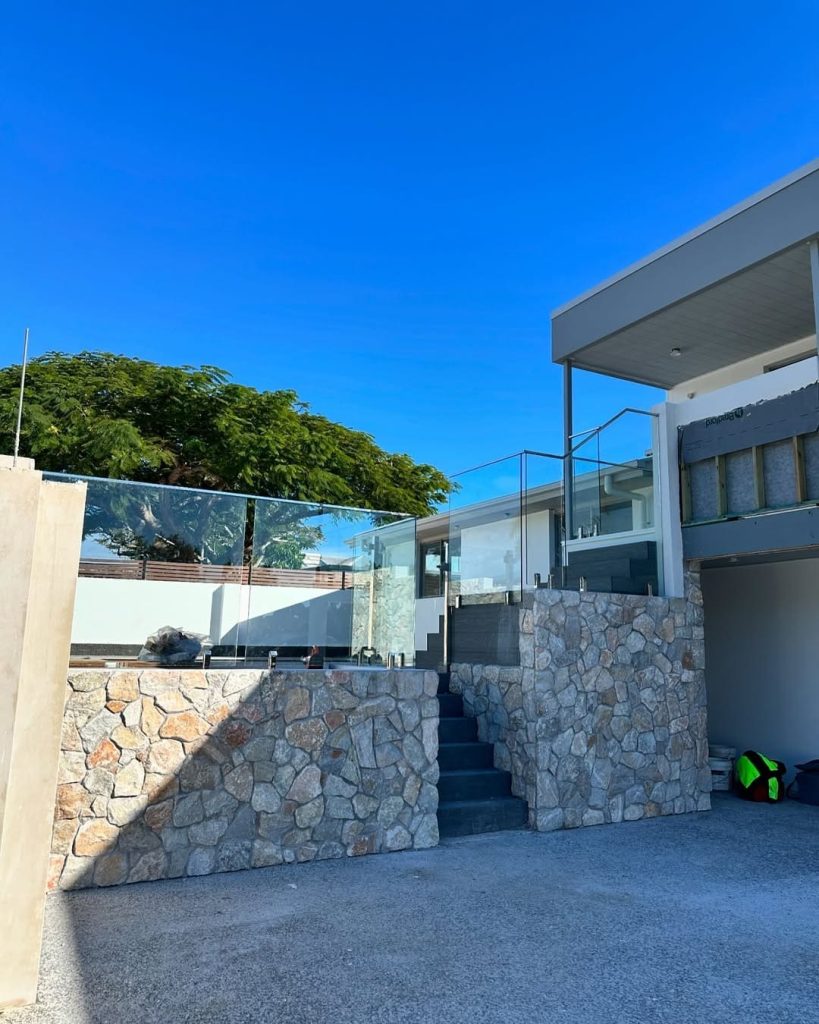 Full Flex Fencing repairing a concrete retaining wall on a Gold Coast property. 