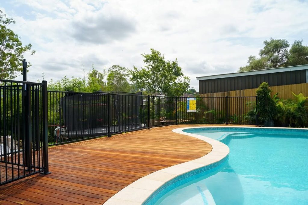The Full Flex Fencing team securing an aluminium fence on a property in the Gold Coast.