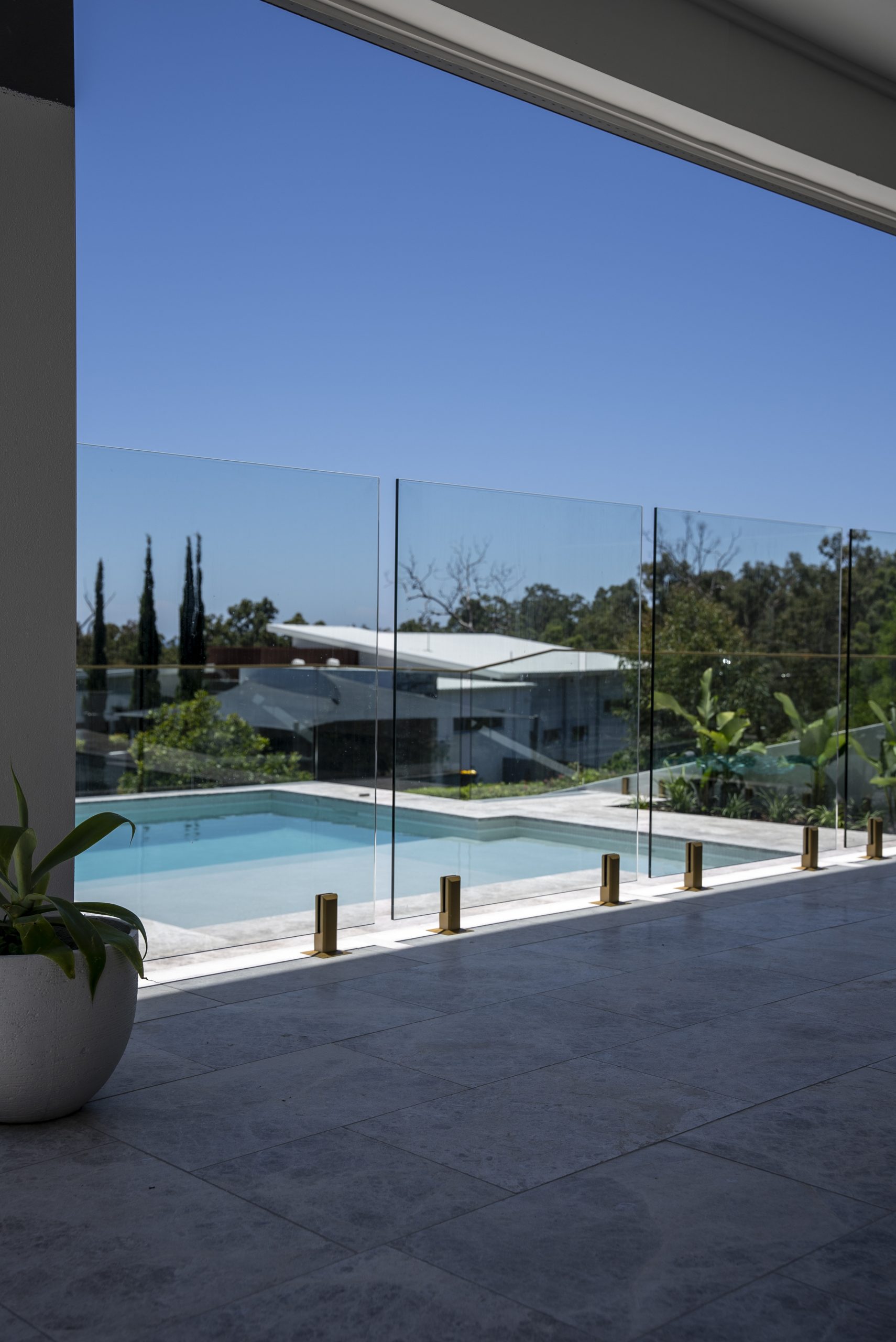 Full Flex installing a glass pool fence in a Brisbane home 