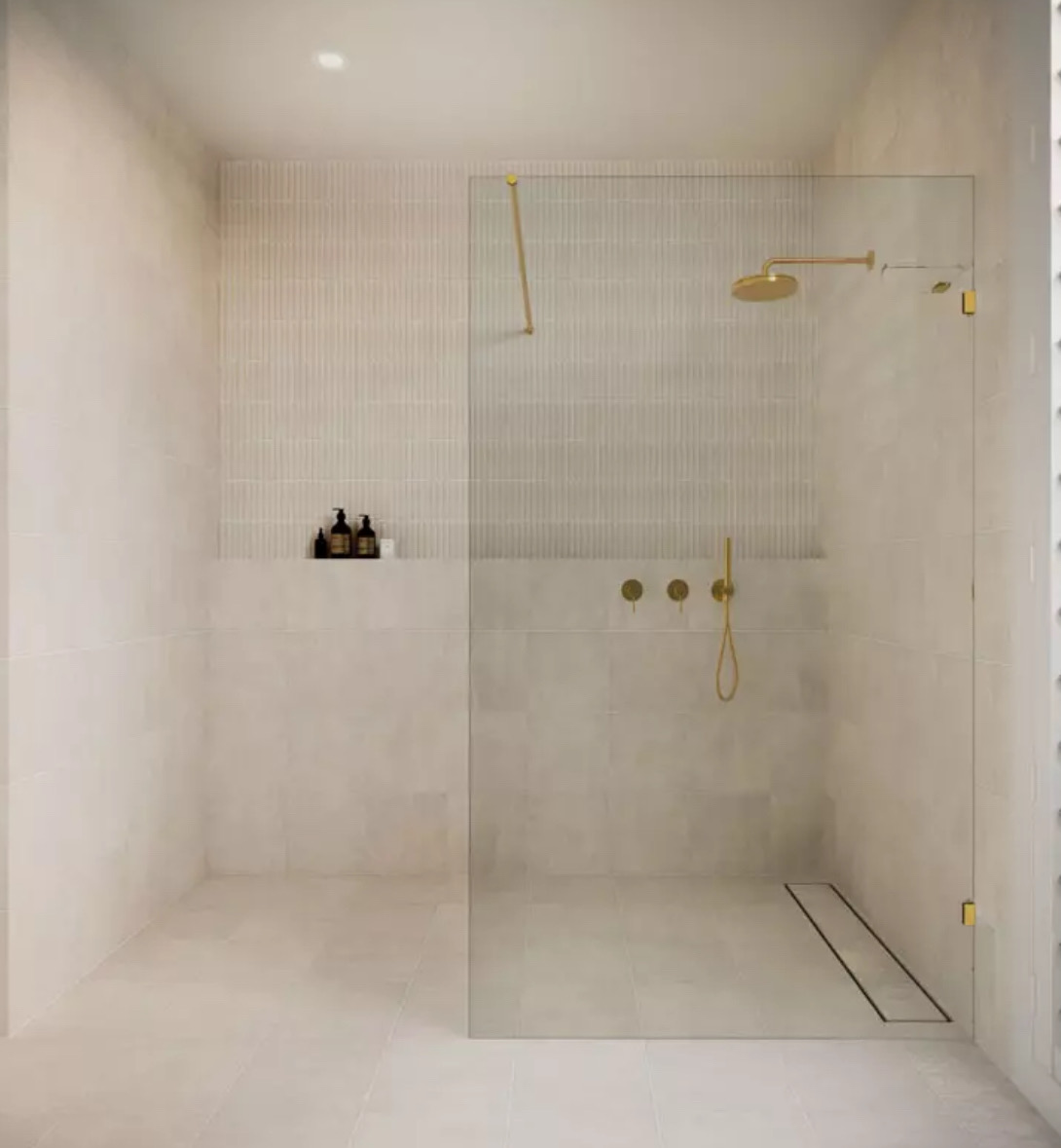 Full Flex Fencing fitting a frameless glass shower screen in Gold Coast bathroom.