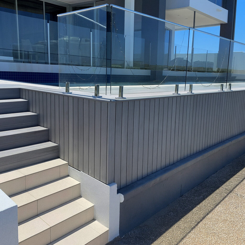 Exterior wall cladding installed beside tiled steps in a Brisbane home.